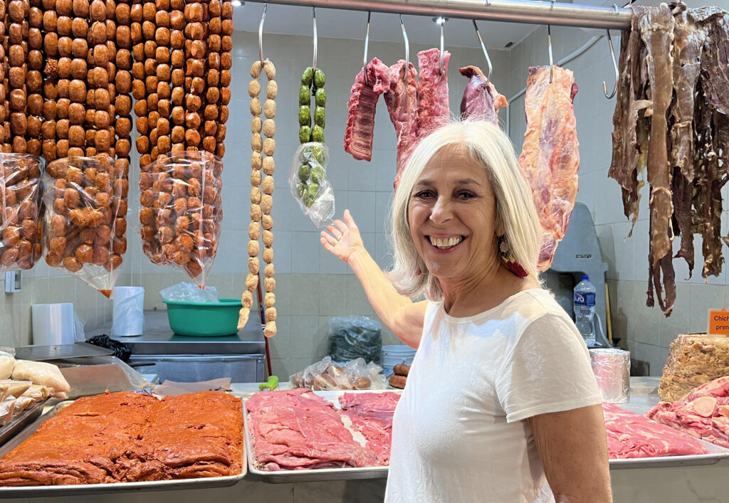 Donna at the market buying meat